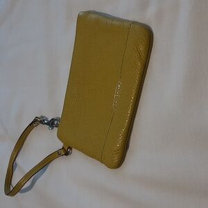 Coach Park Pebbled Wristlet. Yellow.‎